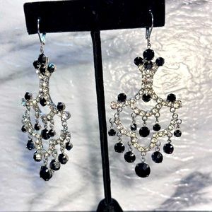 Black and white rhinestone adorned silver tone dangle earrings